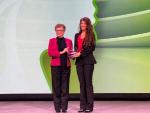 Photo of Stephanie Miller receiving NSC Marion Martin Award from NSC President Lorraine Martin