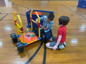 Photo: two students at Claxton Elementary use TubeLox equipment purchased with UCOR mini-grant funds to build a racing car