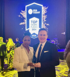 Mary Alice Douglas, UCOR Human Resources Manager, and Chris Caldwell, UCOR Communications Manager, accept the Top Workplaces USA award in New York City.