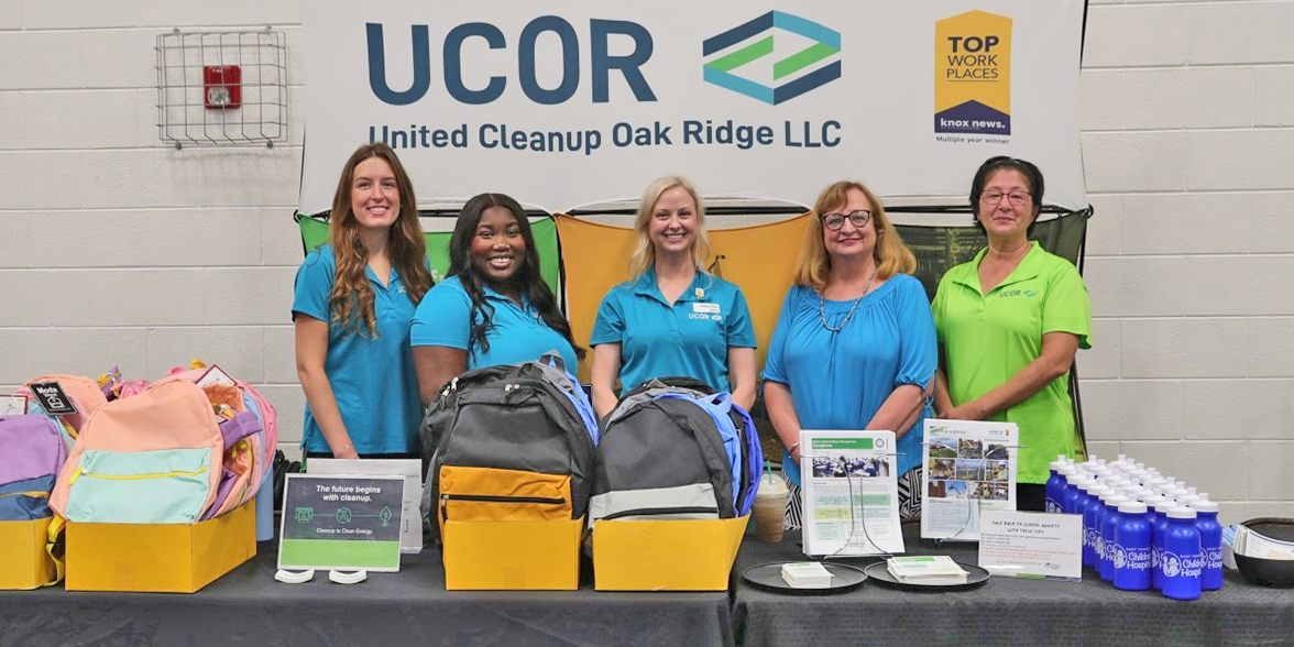 backpacks UCOR and East Tennessee Children's Hospital representatives at NAACP Back to School fair in Oak Ridge