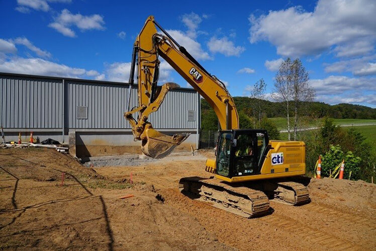 Excavator preparing the way for new driveway for the new Technology Demonstration Testbed