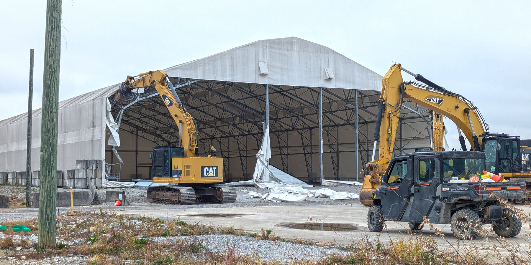 Heavy equipment removing the K-2500-AB tent