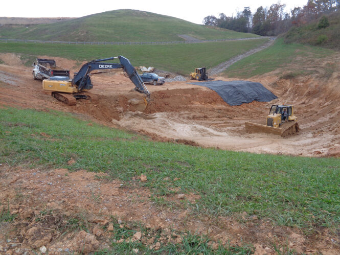 Crews work to remove sediment from an ORRL landfill