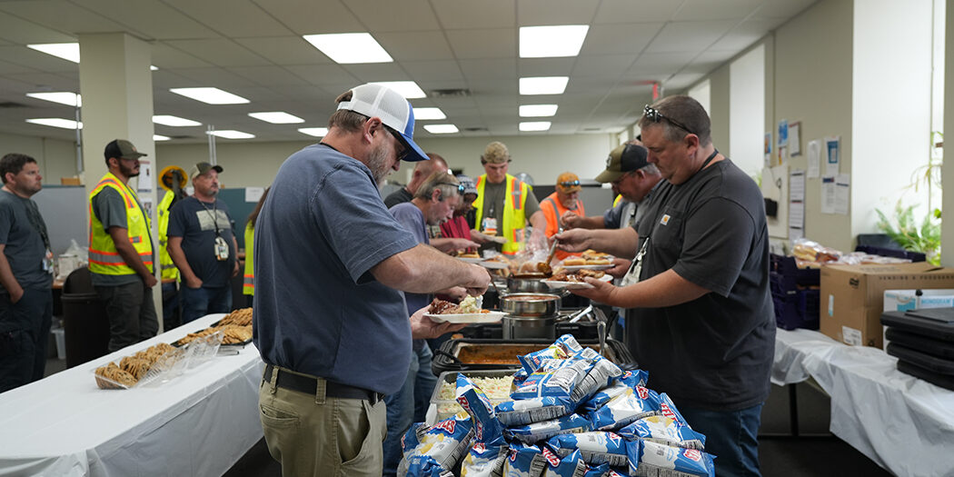 Photo of workers getting food at the celebration lunch
