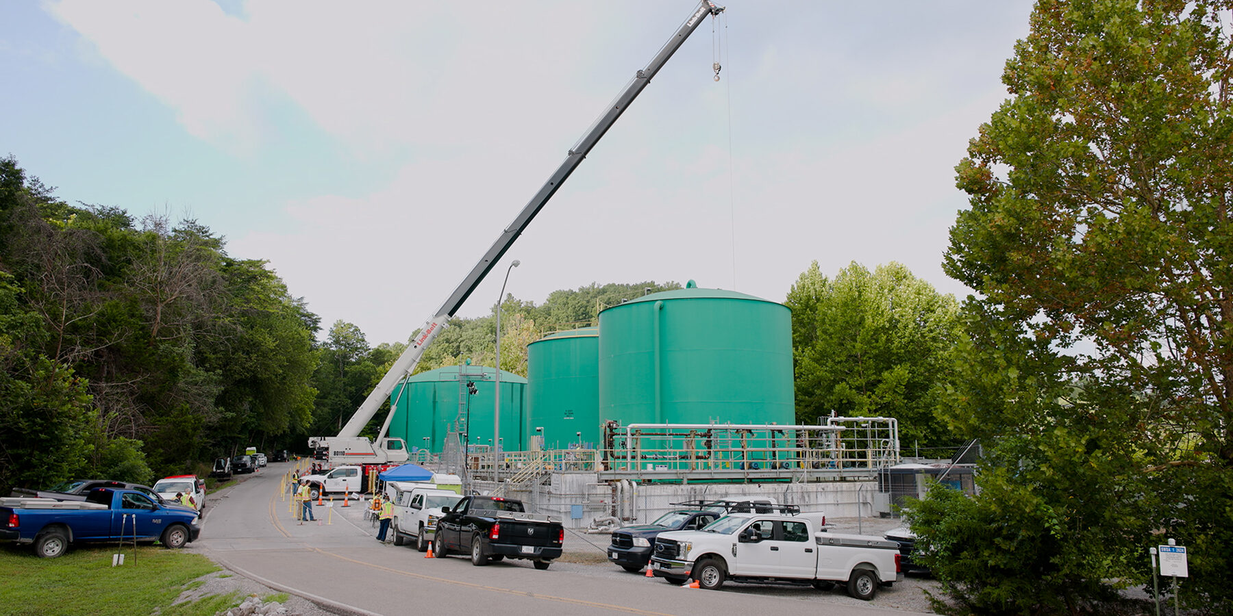 Crews use crane to upgrade piping at the Process Waste Treatment System