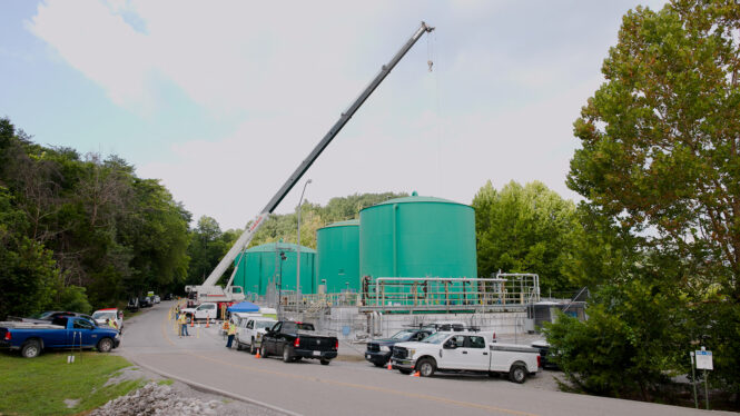 Crews use crane to upgrade piping at the Process Waste Treatment System