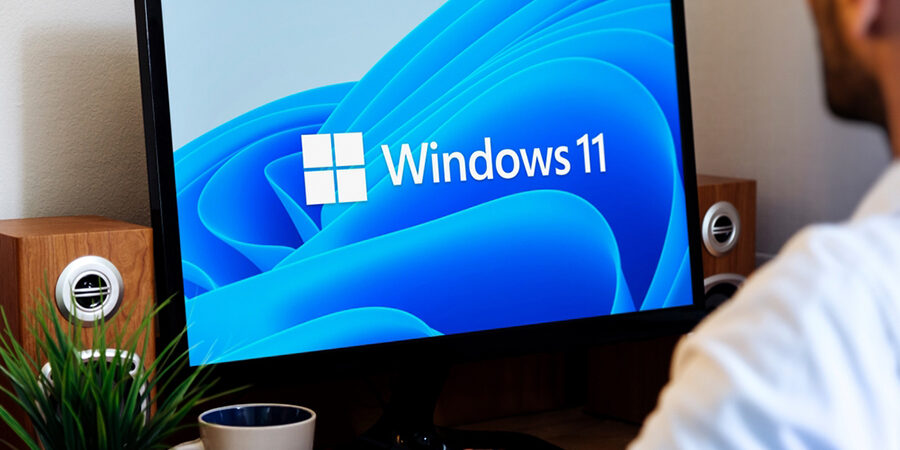 Windows,11,Logo,On,The,Laptop,Screen.,User,With,The