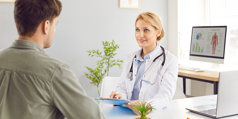 Female,Young,Doctor,Wearing,White,Medical,Uniform,Talking,To,Discuss